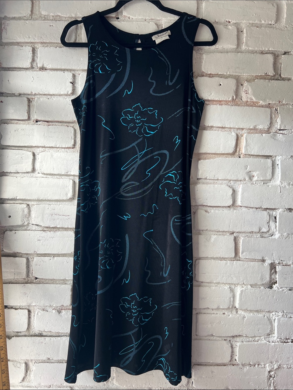 Slinky crew neck lightweight drape black dress with blue pattern throughout